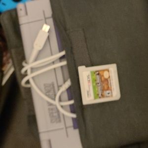 A 3DS With The Charger, Case, and Old Minecraft